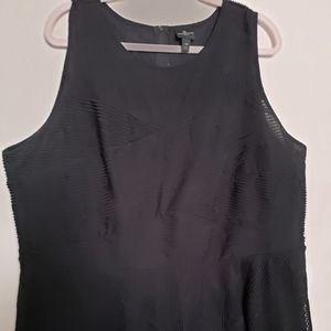 Sleeveless top with peplum bottom